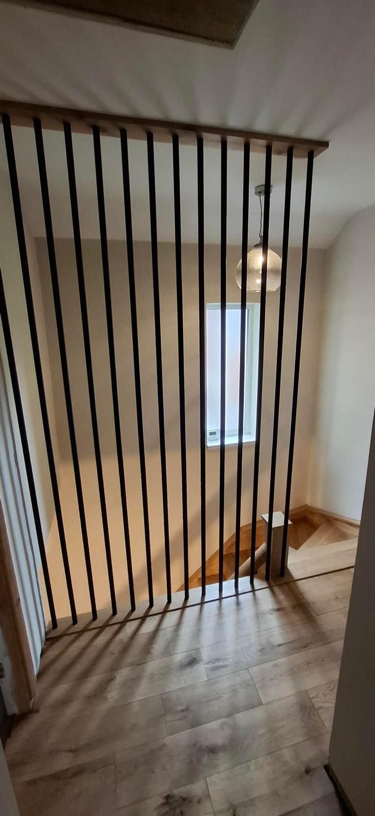 Oak balustrade fitted alongside a glass stair panel