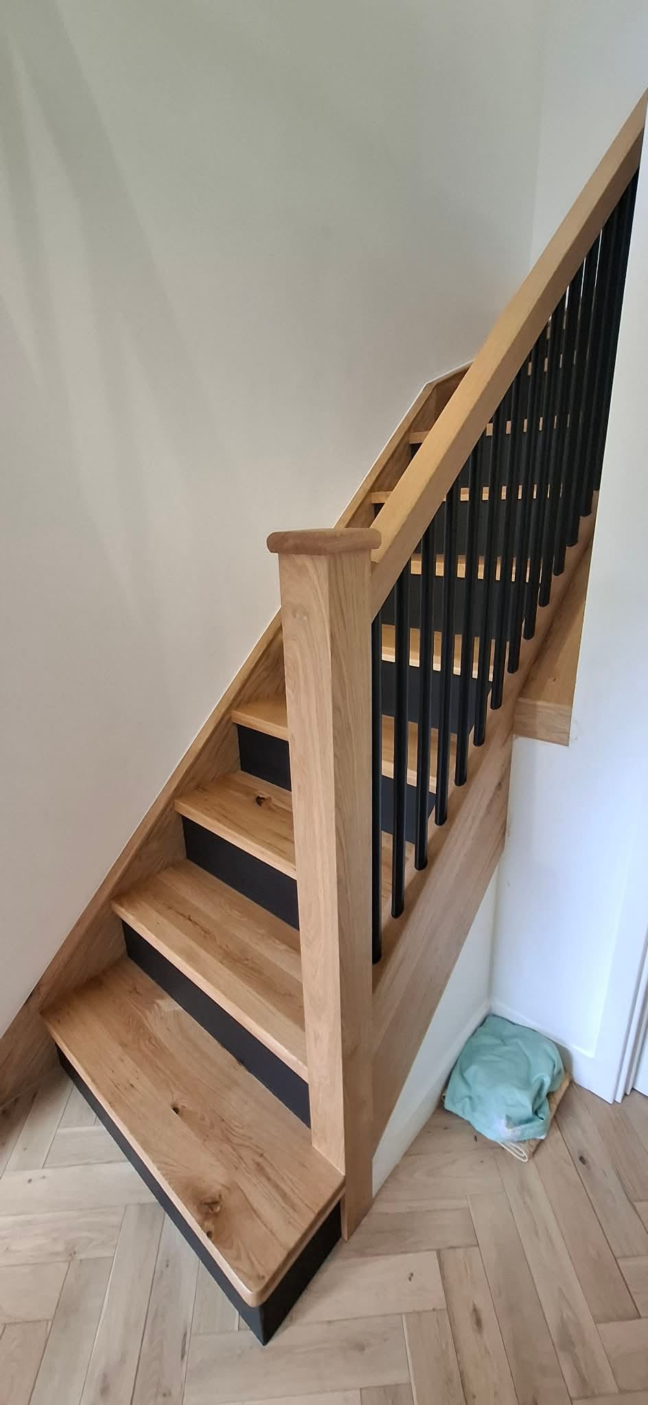 Close-up of an oak handrail joint on a fitted balustrade