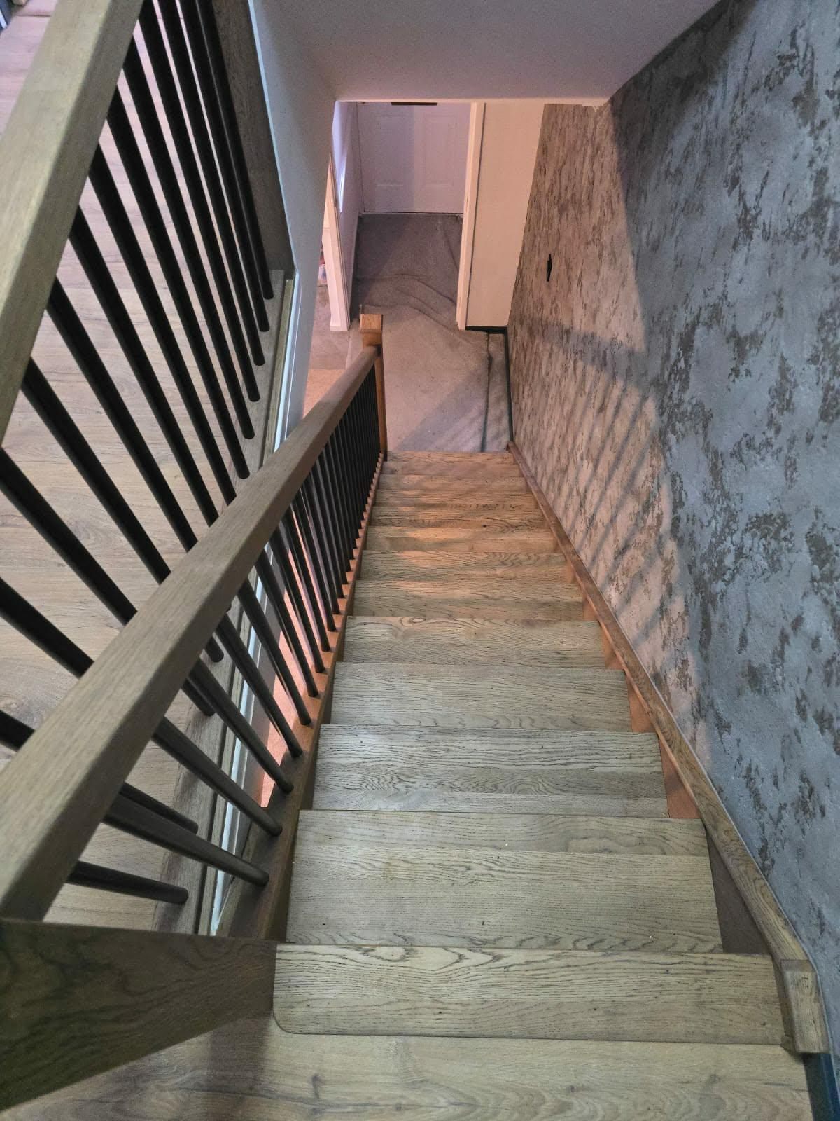 Balustrade and staircase viewed from the top landing looking down
