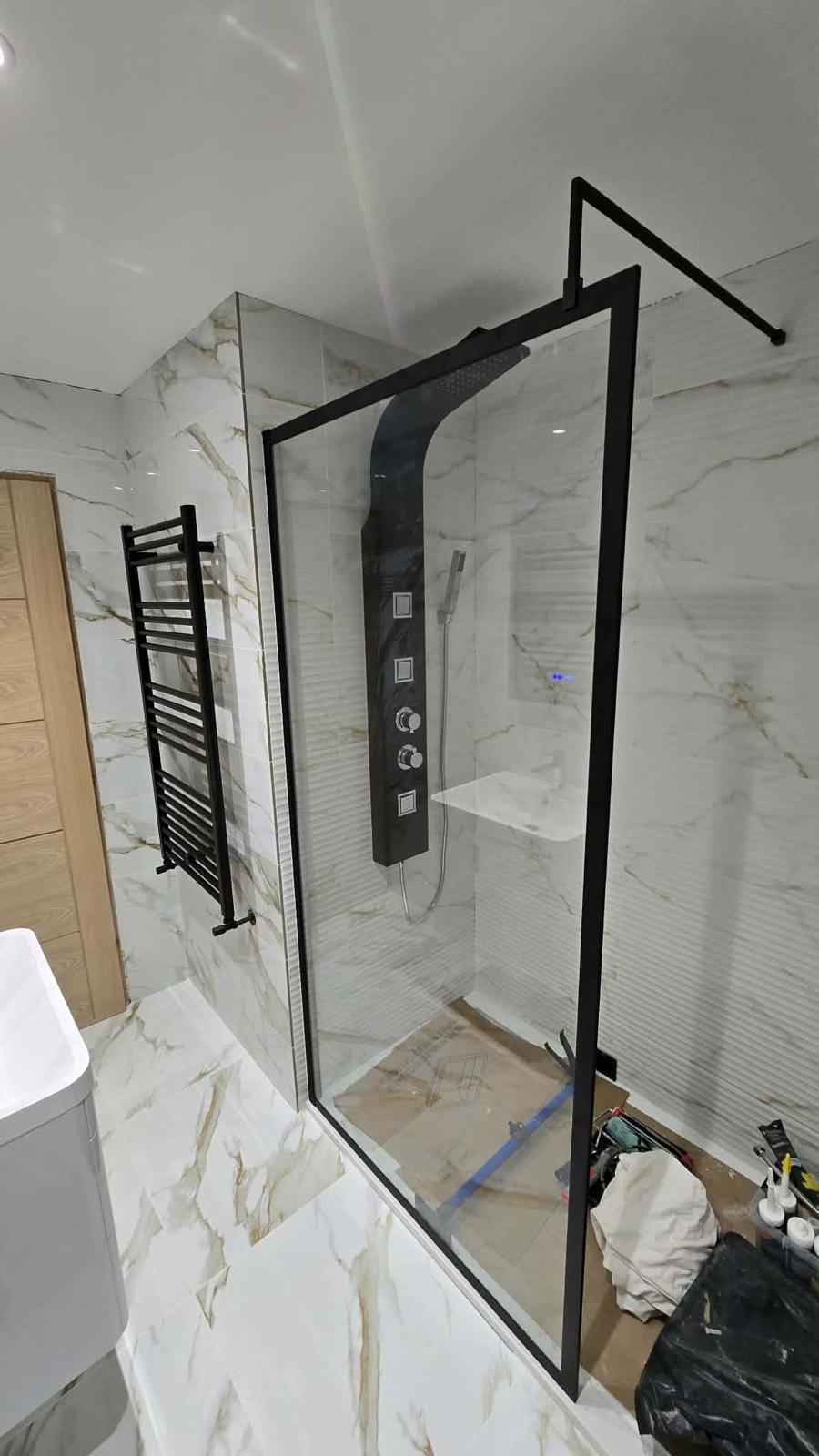 Complete bathroom fit-out with bespoke vanity unit and fitted mirror