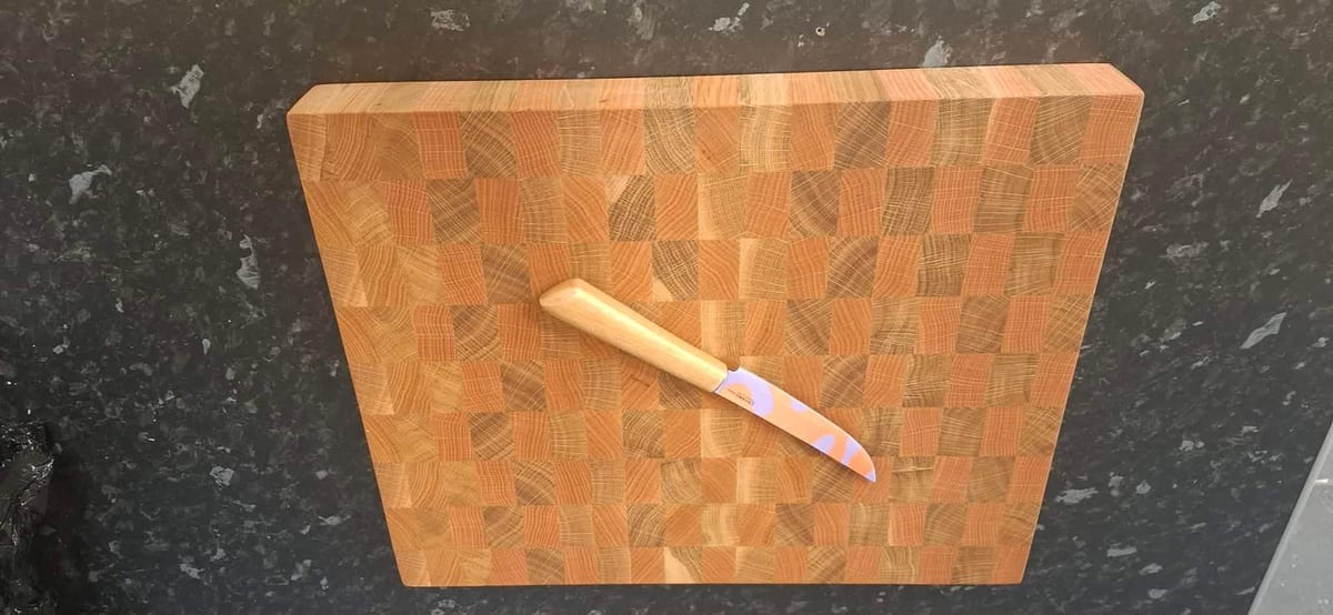Ash cutting board with a hand-cut handle