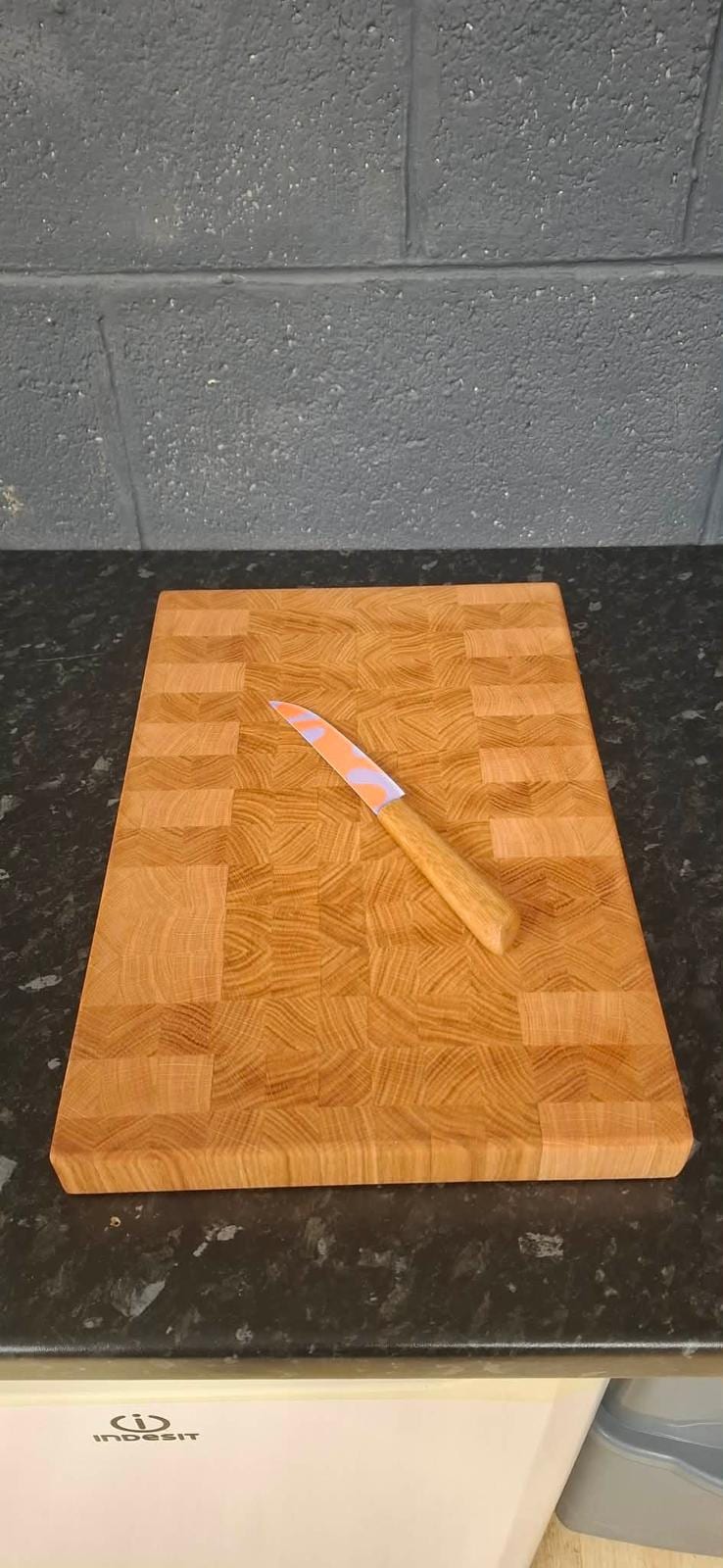 Solid oak serving board with a juice groove