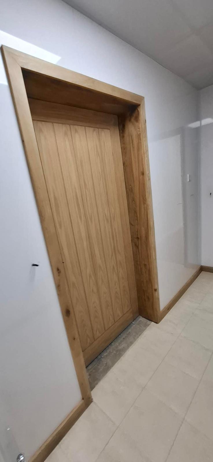 Bespoke oak door casing fitted to an internal opening