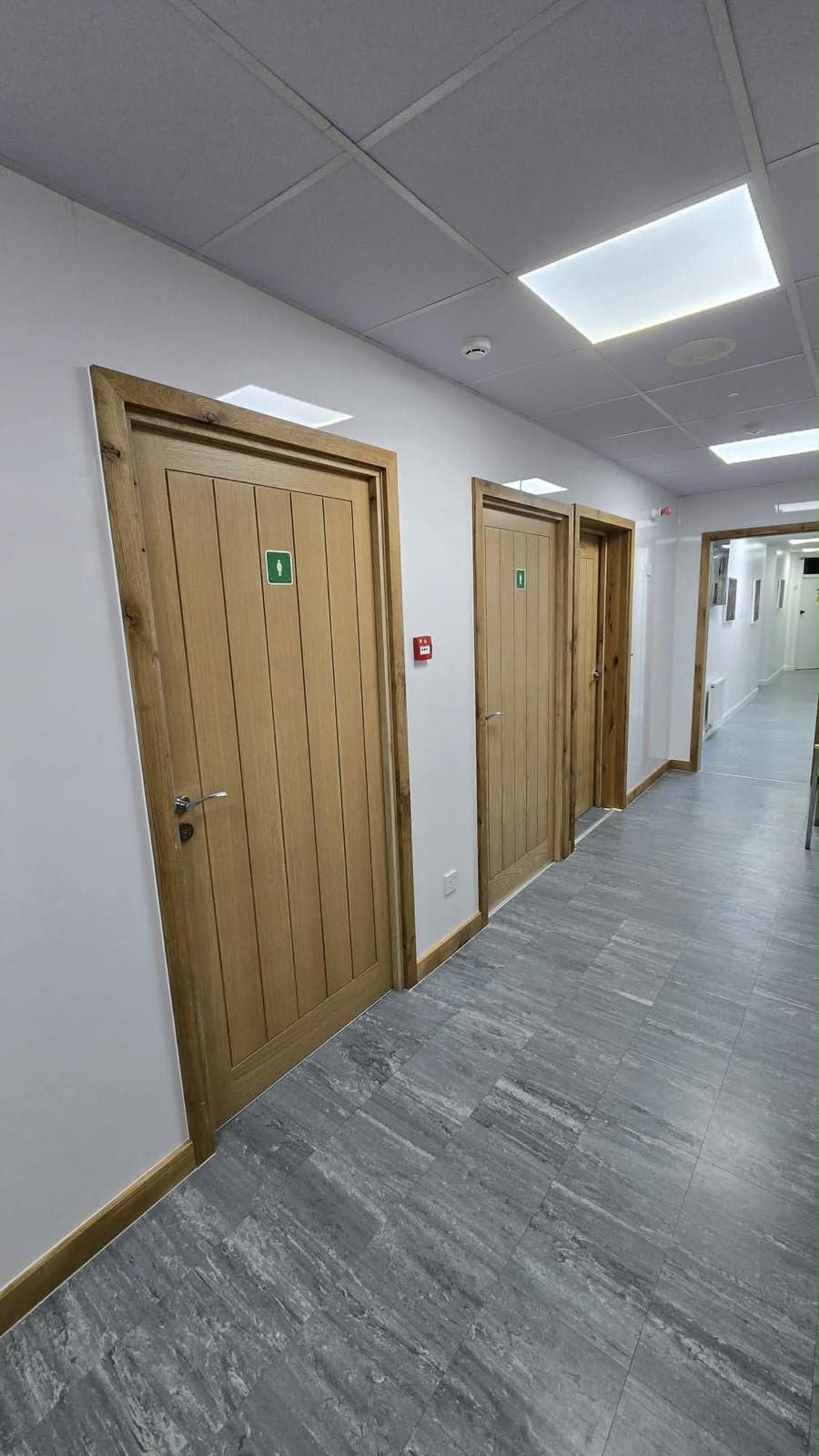 Oak door frame with matching skirting fitted in a renovated room