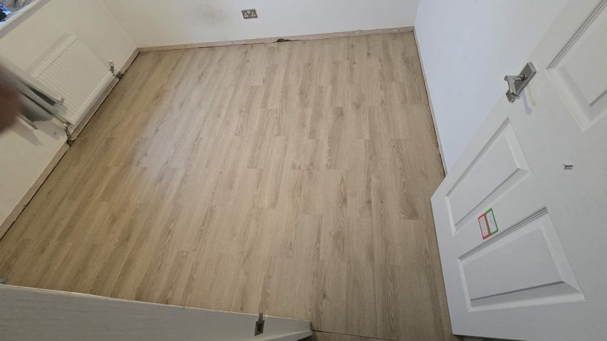 Engineered wood flooring fitted throughout an open-plan room