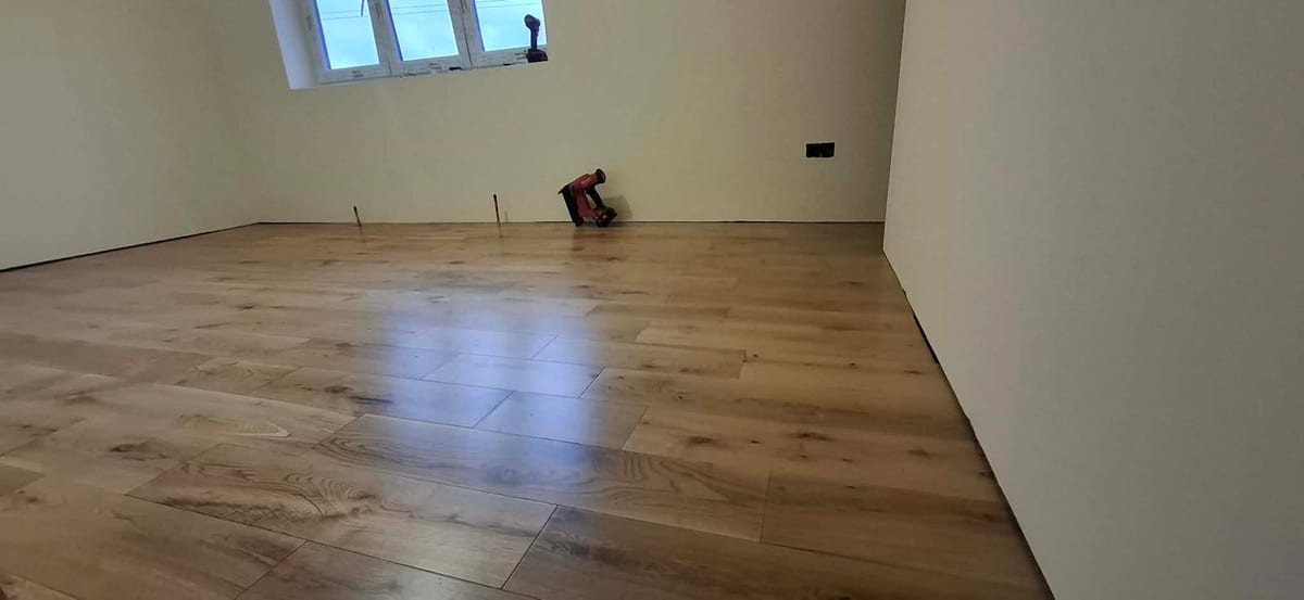 Oak-effect flooring fitted in a hallway renovation