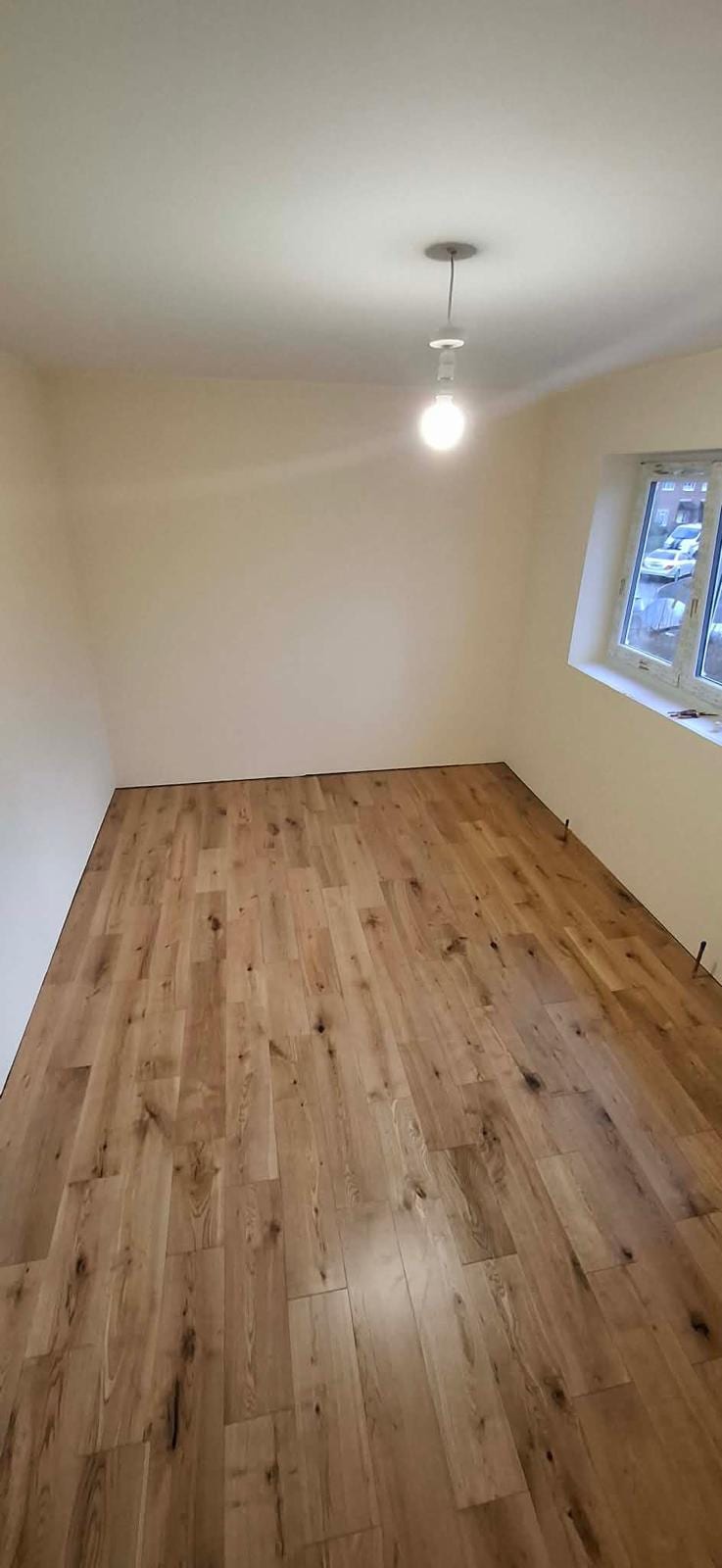 New flooring fitted in a room ready for skirting