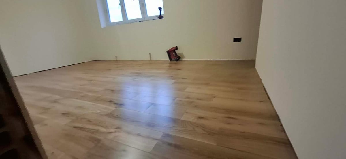 Engineered wood flooring fitted throughout an open-plan room