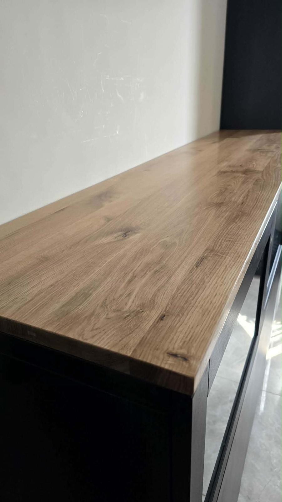 Close-up of solid oak shelf grain and edge detail, hand-finished