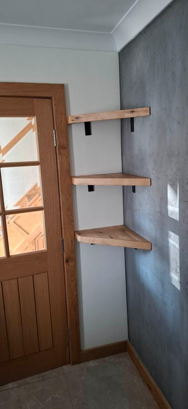 Floating oak shelves fitted in a kitchen