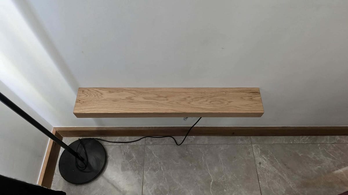 Solid oak floating shelf fitted above a radiator