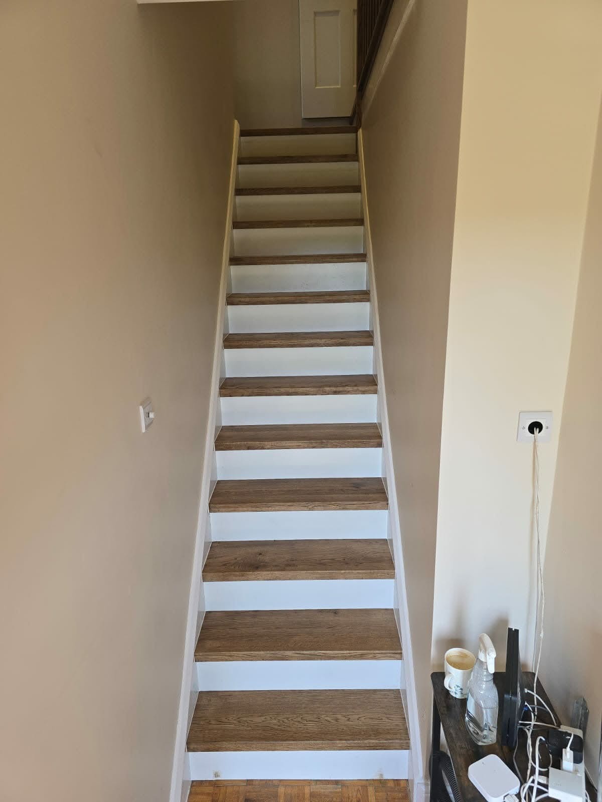 New oak treads and risers laid over an original staircase, natural grain finish