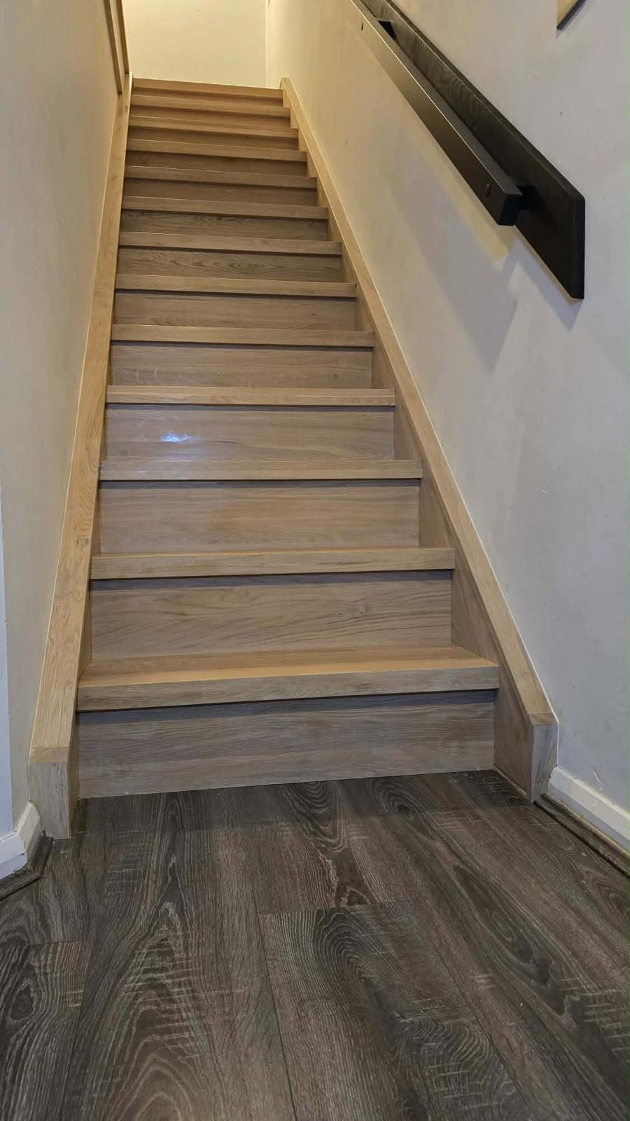 Oak staircase overlay with matching newel post and handrail