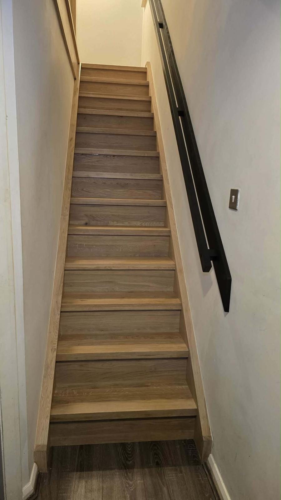 Turning staircase fitted with solid oak overlay and glass balustrade panel