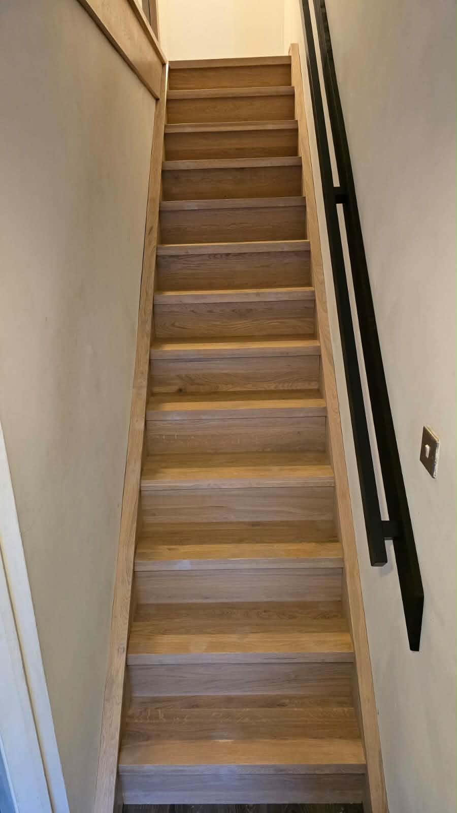 Freshly fitted oak stair treads with visible knot detail