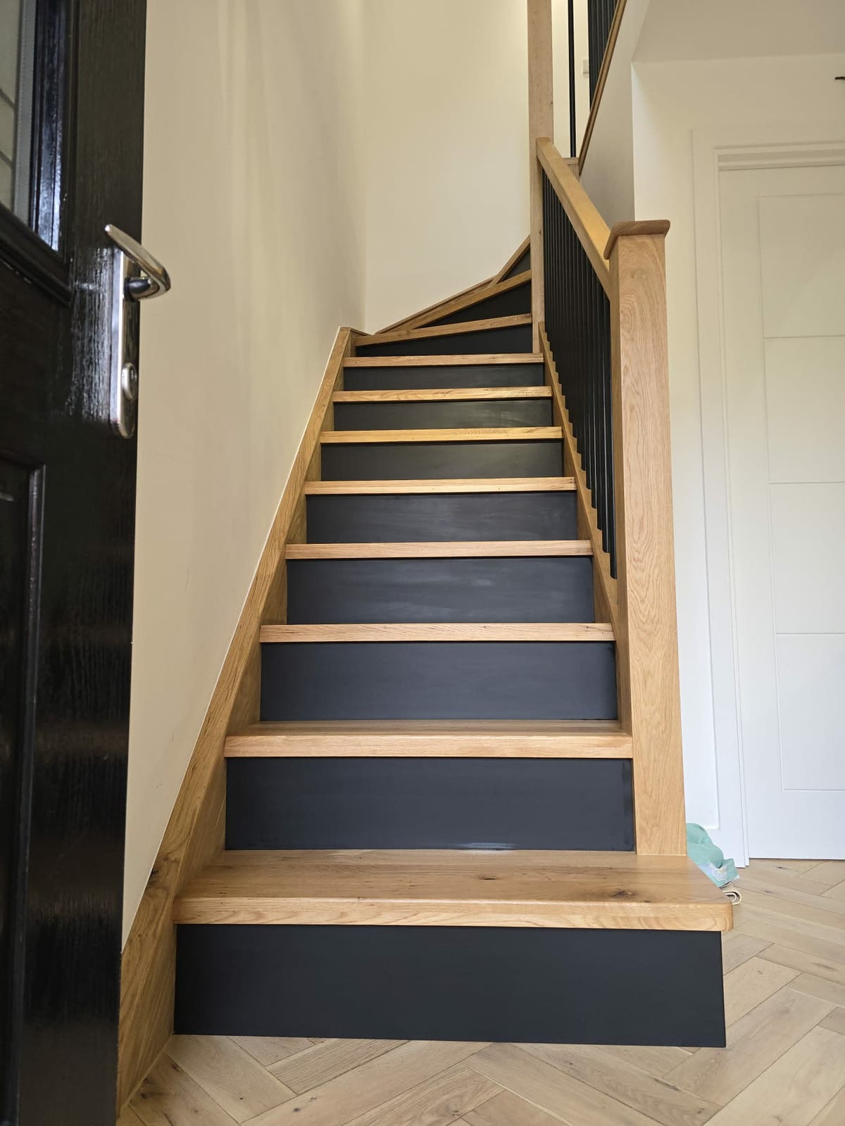 Straight-flight oak stair overlay with white-painted stringer