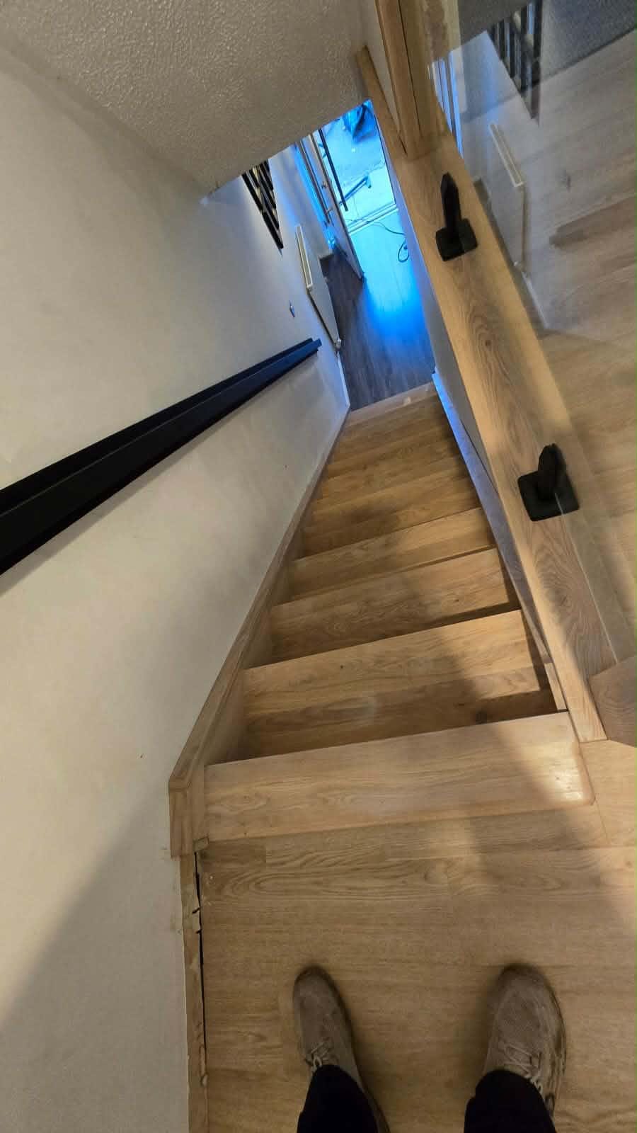 New oak treads and risers laid over an original staircase, natural grain finish