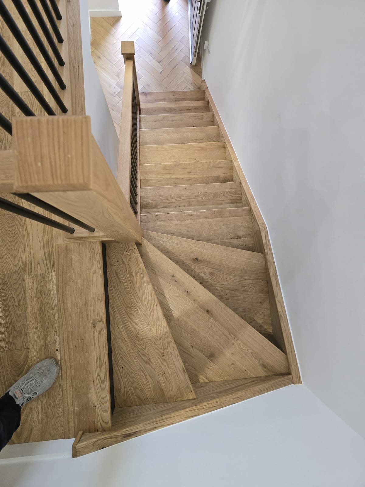 Oak staircase overlay with matching newel post and handrail