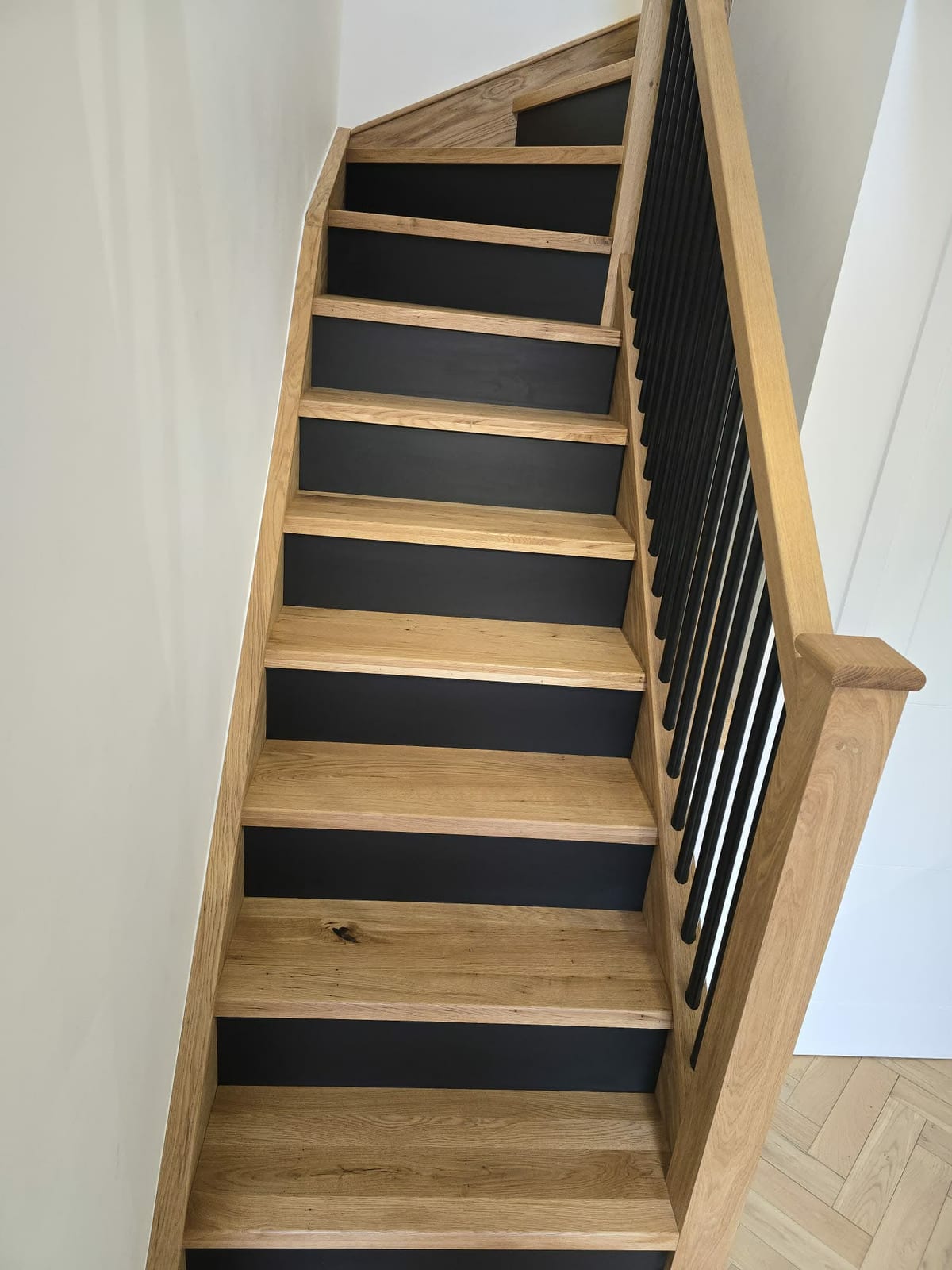 Freshly fitted oak stair treads with visible knot detail