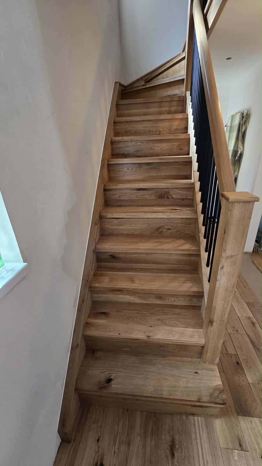 Straight-flight oak stair overlay with white-painted stringer
