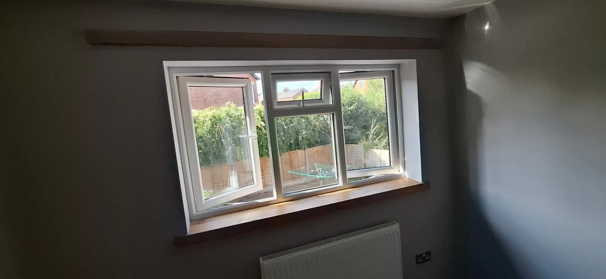 Oak window sill and matching board fitted above a radiator