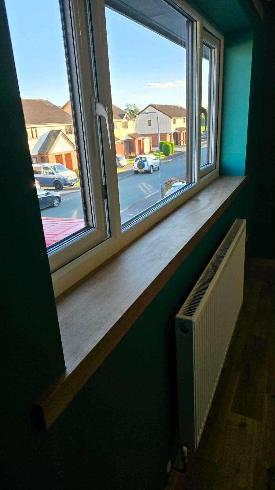 Close-up of a solid oak window sill profile, newly fitted
